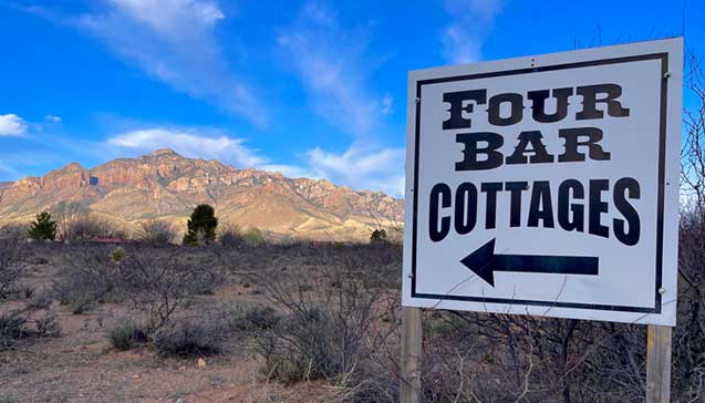 The sign at the entrance of Four Bar Cottages